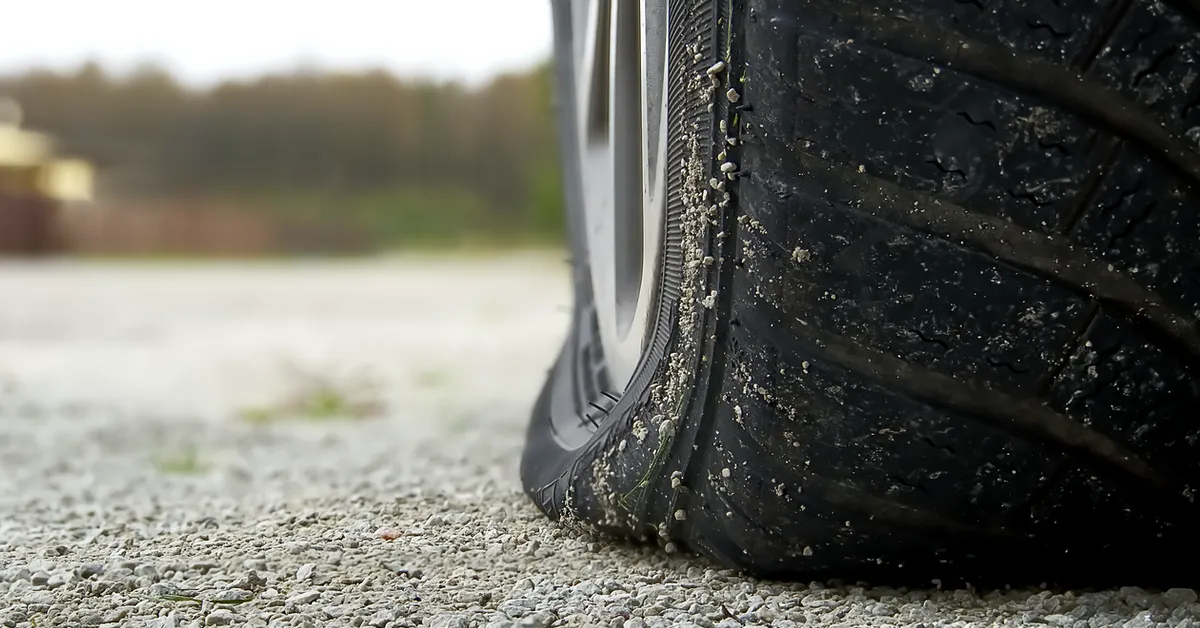 A car with a flat tyre.